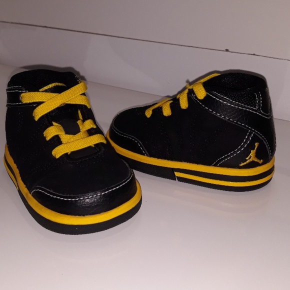 black and yellow infant jordans